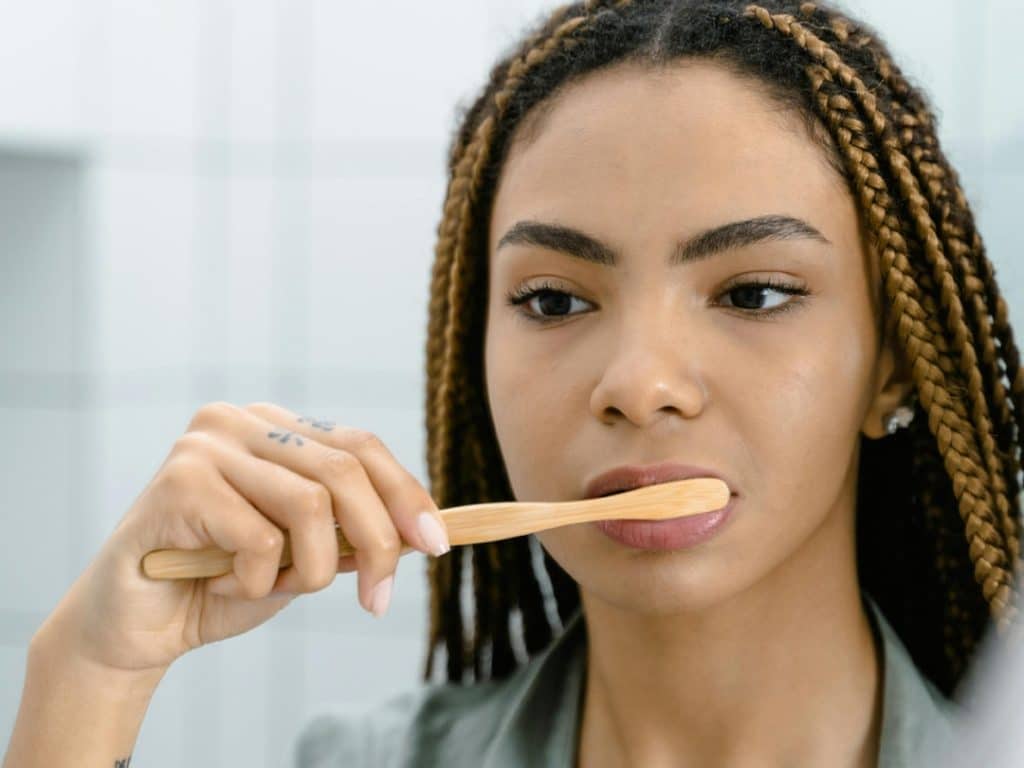Woman brushing her teeth