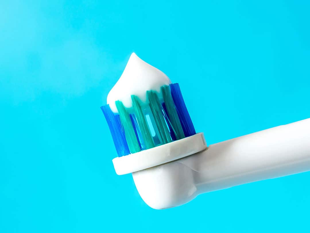 fluoride Understanding Fluoride: fluoride toothpaste on a toothbrush