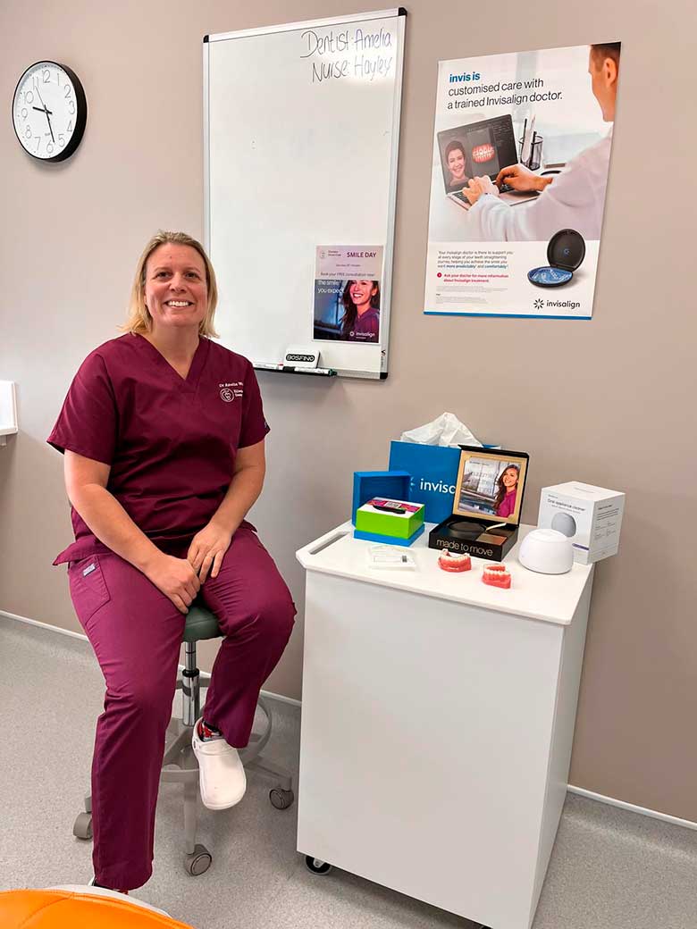 Orthodontist_in_Plymouth_Invisalign_Clear_Aligners Orthodontist at Eilertsen Dental Care sat down smiling