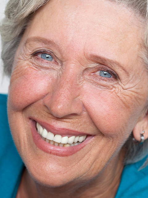 Older lady smiling at camera